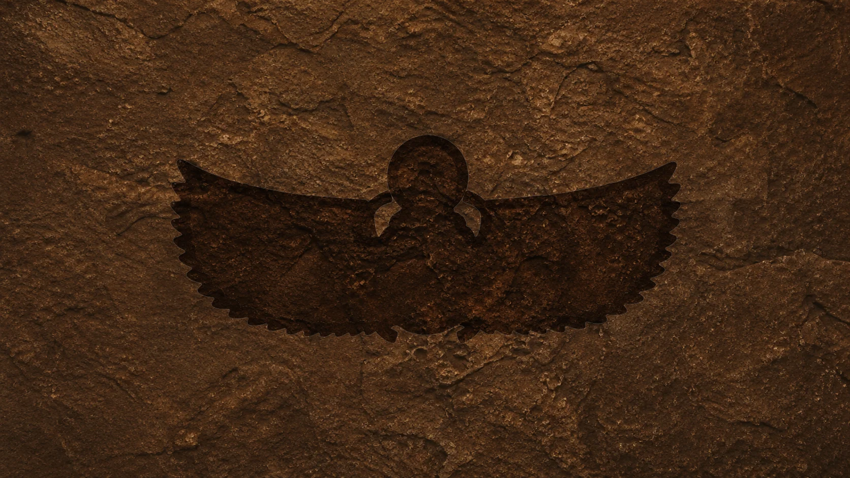 A carved indentation shaped like a winged scarab